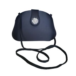 Vintage U.S.Pat Magnetic Snap Black Clutch Features an Ornate Crystal.